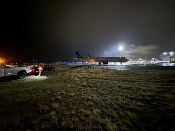 Aircraft on the ramp at night under apron floodlighting