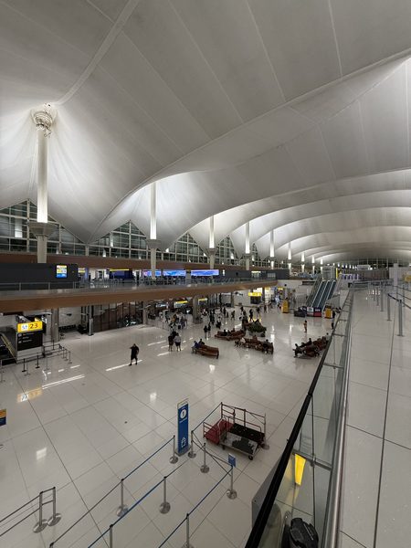 Denver International Airport concourse level under architectural lighting