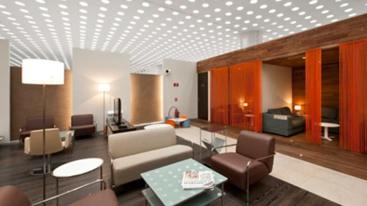 Illuminated feature ceiling in a hospitality space