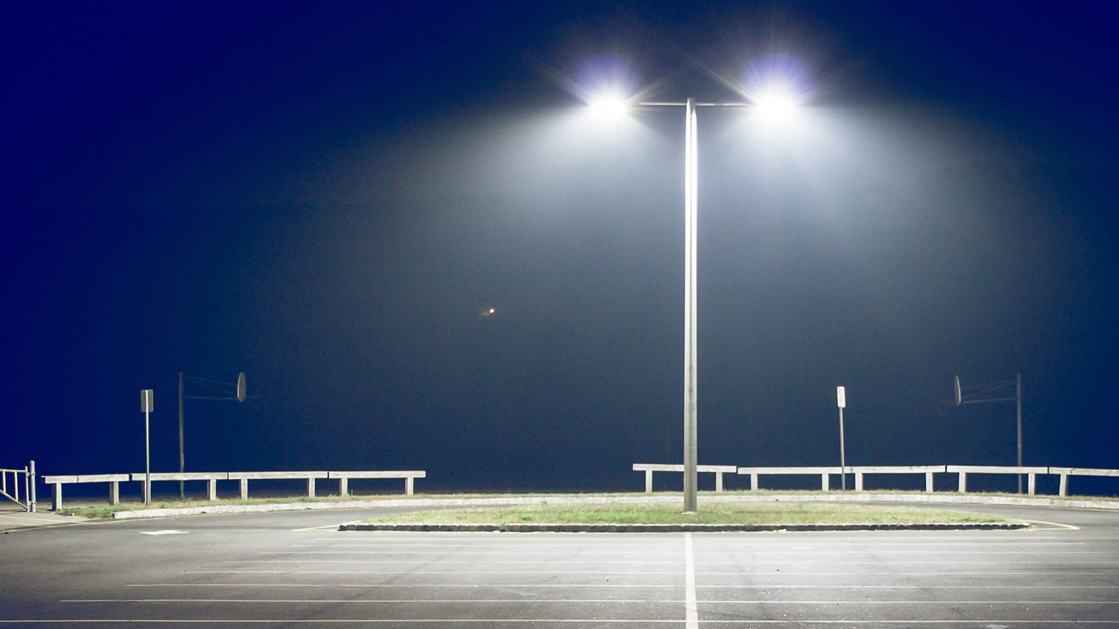 Parking lot pole lighting at night